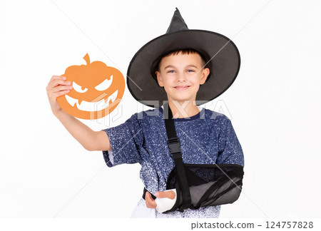 Portrait emotional boy black witch hat, mask pumpkin Jack sweet candies. Isolated white background Portrait emotional boy black witch hat, mask pumpkin Jack sweet candies. Isolated white background 124757828