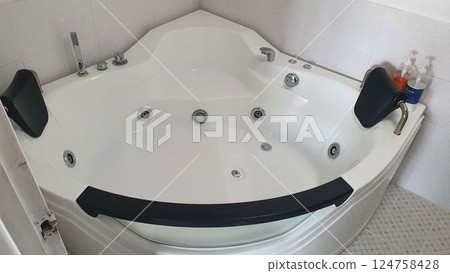Jacuzzi bathtub interior in bathroom Jacuzzi bathtub interior in bathroom 124758428