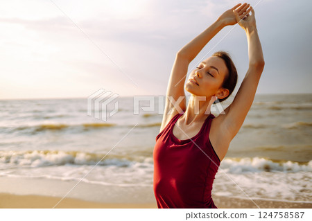Sport woman doing exercises outdoors. Woman doing stretching. Sport, Active life, healthy lifestyle. Sport woman doing exercises outdoors. Woman doing stretching. Sport, Active life, healthy lifestyle. 124758587