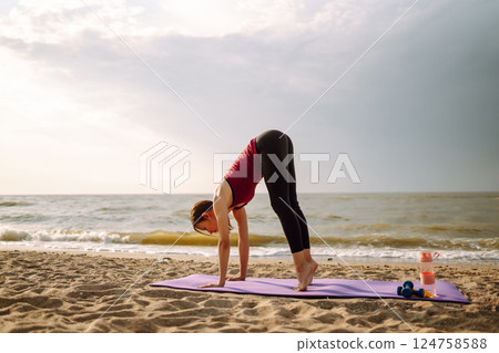 Sport woman doing exercises outdoors. Woman doing stretching. Sport, Active life, healthy lifestyle. Sport woman doing exercises outdoors. Woman doing stretching. Sport, Active life, healthy lifestyle. 124758588