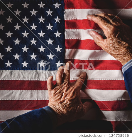 Hands Off America concept with man hands trying to touch and tear out the US flag 124758926