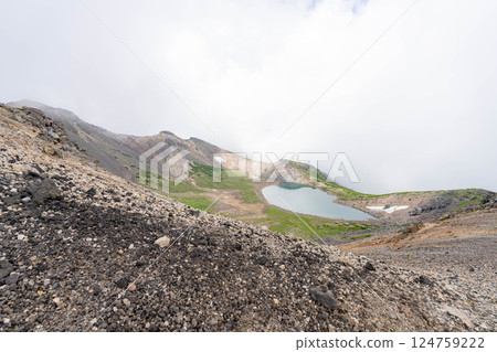 [Pond in the Sky] Mt. Norikura's Gongen Pond in the misty summer [Nagano Prefecture] 124759222
