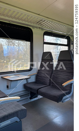 Interior of Empty Train Cabin with Large Windows and Comfortable Seats Interior of Empty Train Cabin with Large Windows and Comfortable Seats 124759395