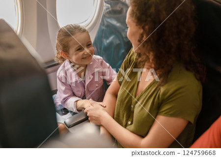 Joyful Moments on a Plane The Heartwarming Connection Between a Child and Their Parent Joyful Moments on a Plane The Heartwarming Connection Between a Child and Their Parent 124759668