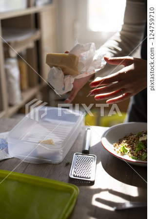 Cooking Preparation with Delicious and Gourmet Cheese in the Kitchen Area of Homes 124759710