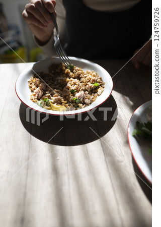 A Flavorful and Delicious Homemade Dish Beautifully Served on a Rustic Wooden Table 124759726