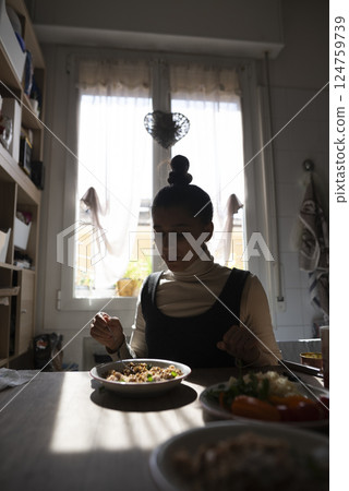 A Candid Moment at the Lunch Table in a Cozy Kitchen Filled with Warmth and Comforting Vibes A Candid Moment at the Lunch Table in a Cozy Kitchen Filled with Warmth and Comforting Vibes 124759739