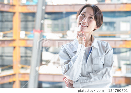 A female worker thinking at a construction site A female worker thinking at a construction site 124760791
