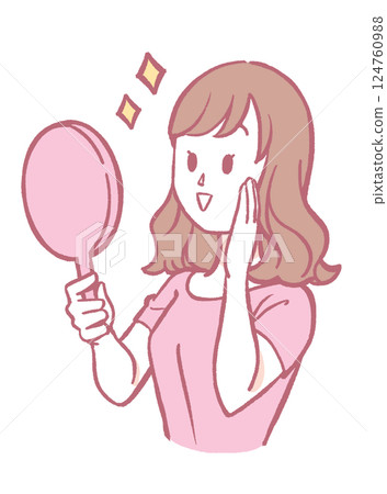 A woman smiling looking at a hand mirror A woman smiling looking at a hand mirror 124760988