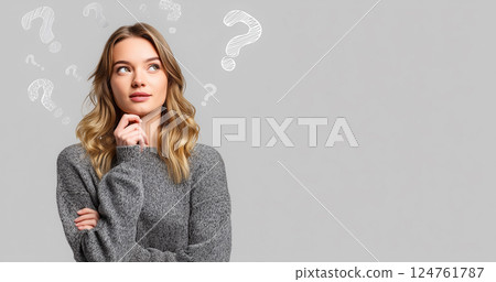 Studio shot of a young woman thinking 124761787
