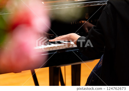 Hands of a man playing the piano Hands of a man playing the piano 124762673