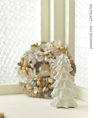 Christmas tree and wreath decorated by the window - Christmas image Christmas tree and wreath decorated by the window - Christmas image 124762704