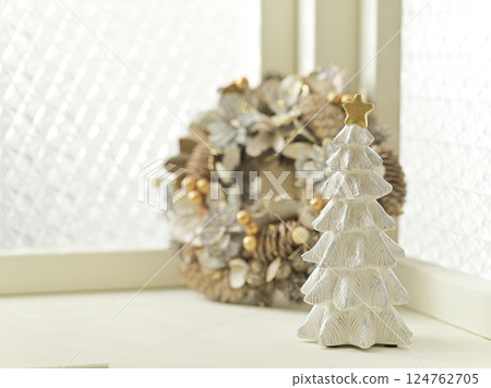 Christmas tree and wreath decorated by the window - Christmas image 124762705