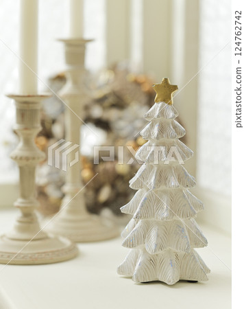 Christmas tree and wreath decorated by the window - Christmas image Christmas tree and wreath decorated by the window - Christmas image 124762742