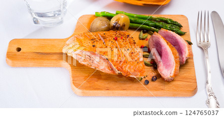 Roasted duck breast with baked onions, asparagus Roasted duck breast with baked onions, asparagus 124765037