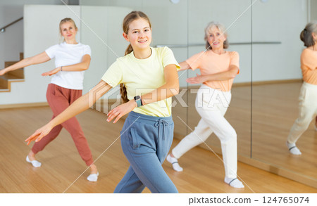 Teenager girl dancing in dance center Teenager girl dancing in dance center 124765074
