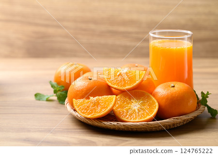 Glass of orange juice and fresh orange fruit on wooden background, Healthy drink 124765222