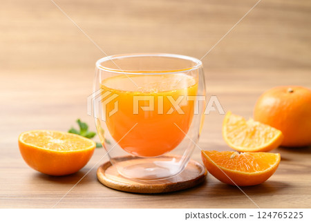 Glass of orange juice and fresh orange fruit on wooden background, Healthy drink Glass of orange juice and fresh orange fruit on wooden background, Healthy drink 124765225