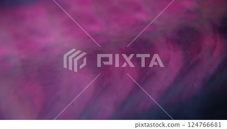Cloudy texture. Defocused hazing purple. Shimmering blinking multicolor paint water flying on blurred dark abstract bokeh light background. 124766681