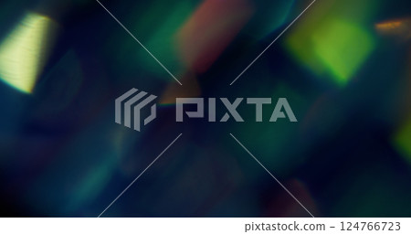Glare effect. Blur flare texture. Defocused green purple yellow multicolor rainbow light on abstract art dark black background. 124766723