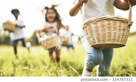Happy children running with baskets of Easter eggs on nature. Blurred background, selective focus. 124767311