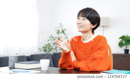 Middle-aged women in casual wear having a conversation Middle-aged women in casual wear having a conversation 124768727