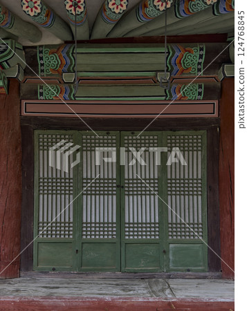 The quiet shadows and natural textures of hanok invite you into a space of peace and nostalgia. 124768845