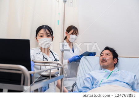 Staff caring for hospitalized patients Staff caring for hospitalized patients 124768885