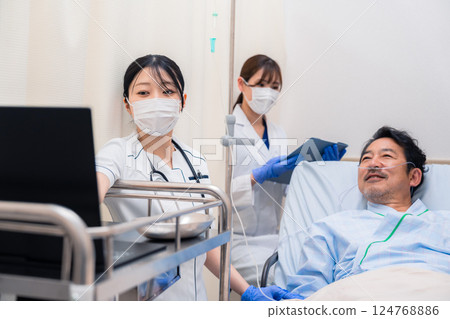 Staff caring for hospitalized patients Staff caring for hospitalized patients 124768886