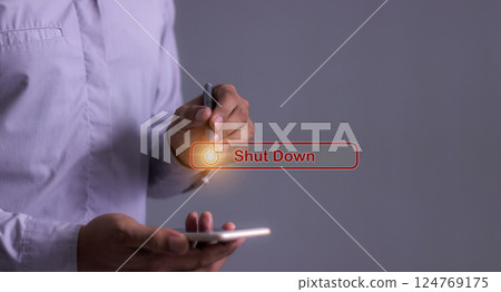 Young man with smartphone hand using a pen touching Shut Down button press power OFF 124769175
