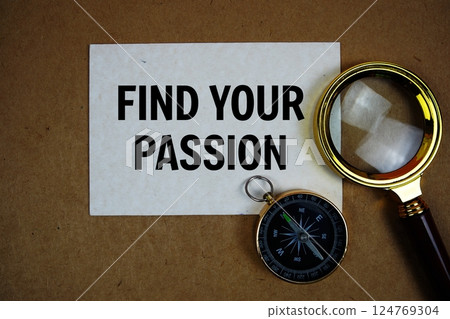 Find Your Passion text on paper torn with compass and magnifying glass on paper craft background Find Your Passion text on paper torn with compass and magnifying glass on paper craft background 124769304