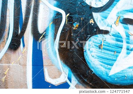 Abstract Blue Graffiti Texture with Black and White Accents for Urban Street Art Style 124771547