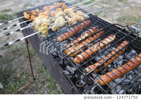Shashlik and lula kebab are grilled over charcoal outside. Street food 124771750