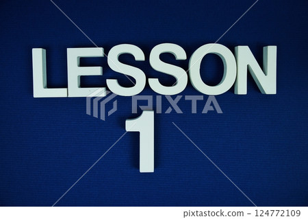 Lesson 1 Lesson One alphabet letters on navy blue background 124772109