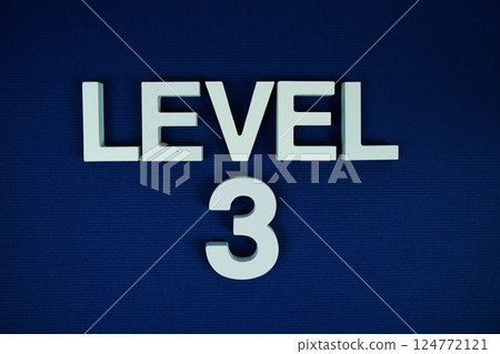 Level 3 Level Three alphabet letters on navy blue background 124772121