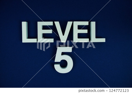 Level 5 Level Five alphabet letters on navy blue background Level 5 Level Five alphabet letters on navy blue background 124772123