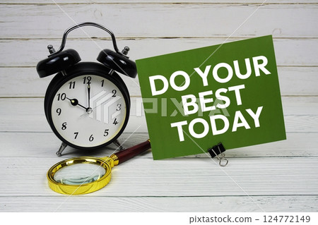 Do Your Best Today text message on paper card with alarm clock on wooden background 124772149