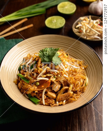 Pad thai in a bowl on the table Thai food 124772957