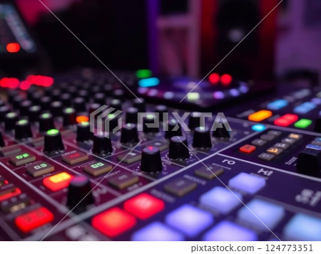 Part sound board DJ mixer closeup with buttons and controls 124773351