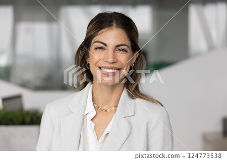 Happy beautiful Hispanic business leader woman posing for head shot Happy beautiful Hispanic business leader woman posing for head shot 124773538