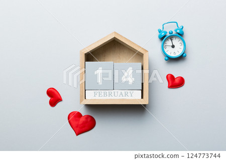 Valentine Day theme with wooden block calendar. Greeting card template for Valentines Day. Top view, copy space for text 124773744