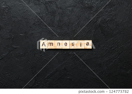 amnesia word written on wood block. amnesia text on table, concept 124773782