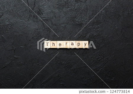 therapy word written on wood block. therapy text on cement table for your desing, concept 124773814
