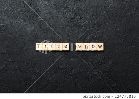 Trade Show word written on wood block. Trade Show text on cement table for your desing, concept 124773816