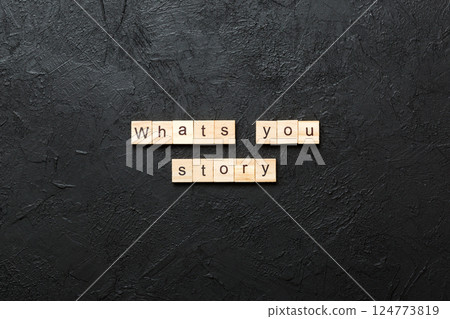What's your story word written on wood block. What's your story text on cement table for your desing, Top view concept What's your story word written on wood block. What's your story text on cement table for your desing, Top view concept 124773819