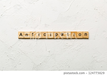 anticipation word written on wood block. anticipation text on cement table for your desing, concept 124773829