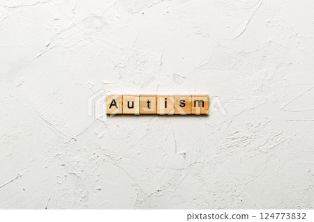 autism word written on wood block. autism text on table, concept 124773832