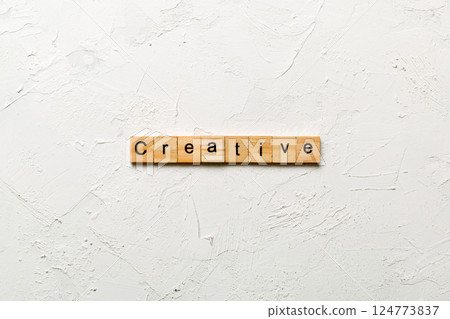 creative word written on wood block. creative text on table, concept 124773837