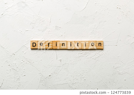 Definition word written on wood block. Definition text on cement table for your desing, concept 124773839
