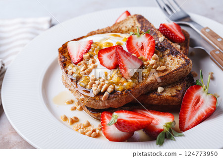 French toast with strawberries and passion fruit. French toast with strawberries and passion fruit. 124773950